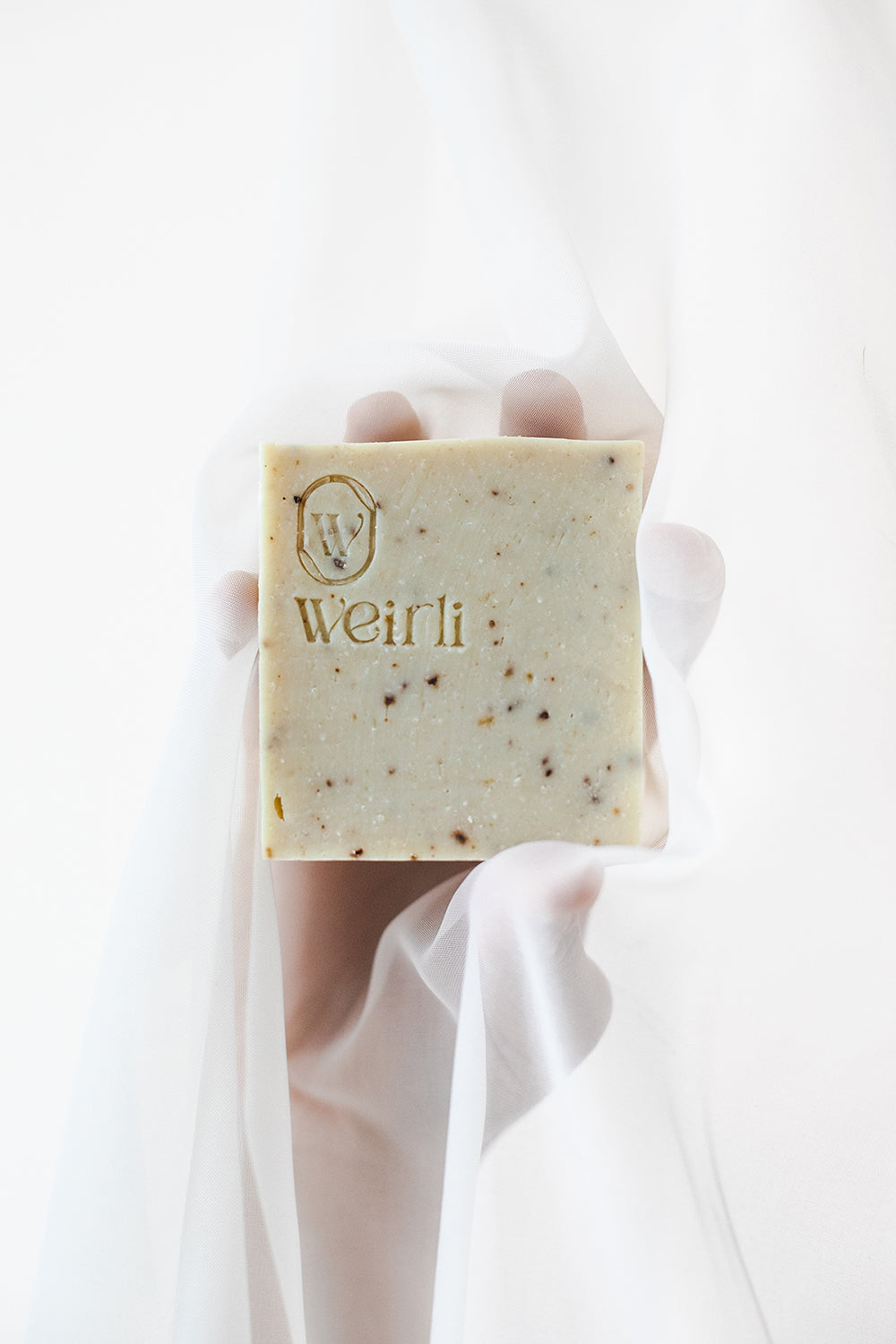 Weirli's Rice and Black Pepper Soap Square on Fabric